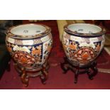 A pair of large contemporary Chinese stoneware and floral enamel decorated jardinieres on stands,