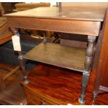 An early 20th century mahogany two-tier low side table, on turned supports, w.63.5cm