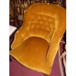 A Victorian mustard Dralon buttoned upholstered tub nursing chair, raised on turned forelegs,