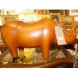 A contemporary tan leather stitched model of a Rhino, length 56cm