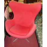 After Arne Jacobsen - a circa 1970s egg shaped chair, with original red cloth fabric upholstery,
