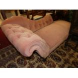 A Victorian mahogany framed and purple Dralon buttoned upholstered scroll end chaise longue,