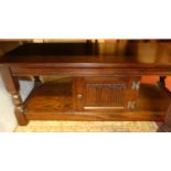 A contemporary Old Charm moulded oak rectangular two-tier coffee table, with single cupboard door,