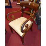 A 19th century mahogany bar back scroll elbow chair, having cream floral upholstered drop-in pad