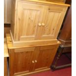 Three various modern pine low double door side cupboards, the largest width 91cm