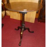 A 19th century mahogany circular tilt-top pedestal tripod table, having birdcage undertier, dia.