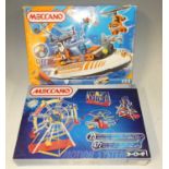 A box containing two Meccano boxed sets, two boxed Scalextric cars, and further accessories