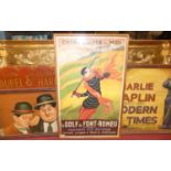 A painted wooden advertising sign for Charlie Chaplin; together with another for Laurel & Hardy; and