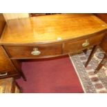 A circa 1900 mahogany bowfront two drawer side table, w.107cm