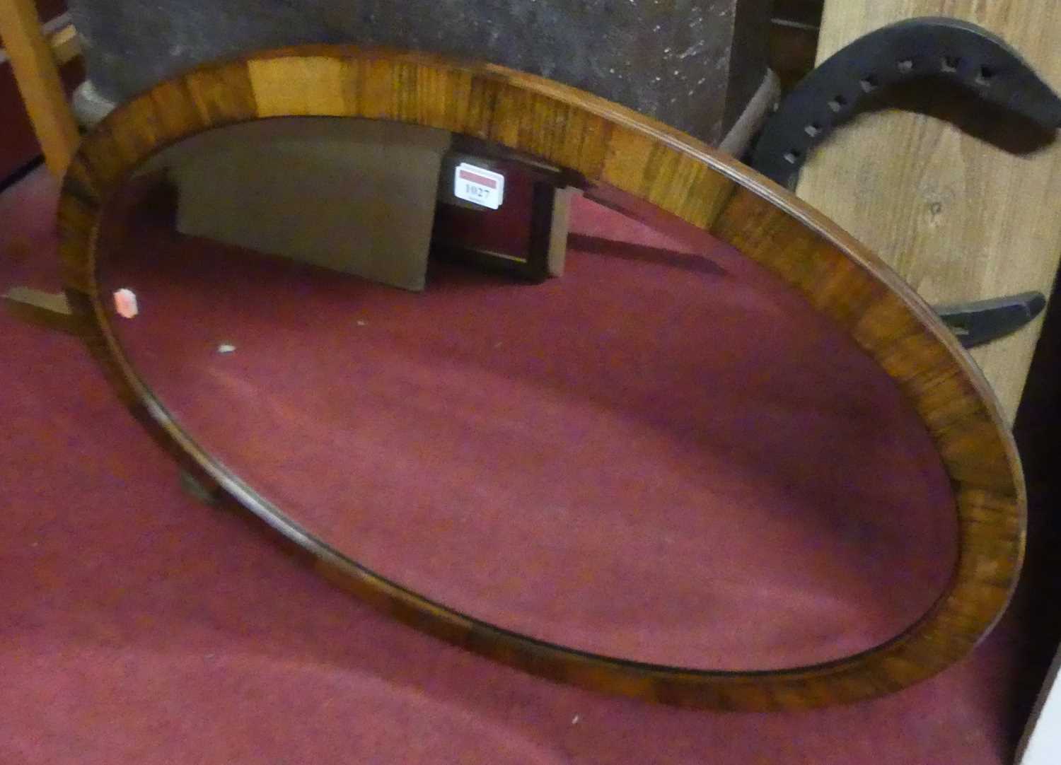 An early 20th century rosewood framed and bevelled oval wall mirror, 80x56cm