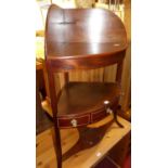 An early 19th century mahogany bow front three-tier single drawer wash stand