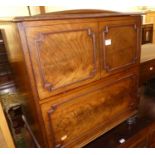 An early 19th century hinge topped commode, with fitted interior, on squat turned supports, w.