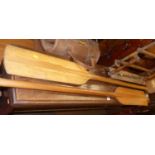 A pair of stained wood paddles, each 136cm; together with a tan leather doctor's bag; and a wool-