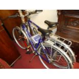 A Raleigh Pioneer 160 gent's bicycle; together with a matching lady's example, with two pumps and
