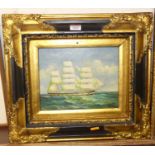 A reproduction gilt framed oleograph depicting a three-masted clipper ship, 20 x 24cm