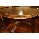 An early Victorian rosewood pedestal breakfast table, having a circular tilt-top to a turned and