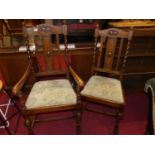 A set of five early 20th century oak slat back barley twist turned dining chairs, each having floral