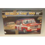 A Scalextric 300 electric model racing box set; together with a group of loose Scalextric track