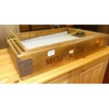 A set of three contemporary stained beech and metal bound graduated twin handled drinks trays, the