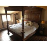 A joined and panelled oak Super King size full tester bed, having twin base section, twin turned