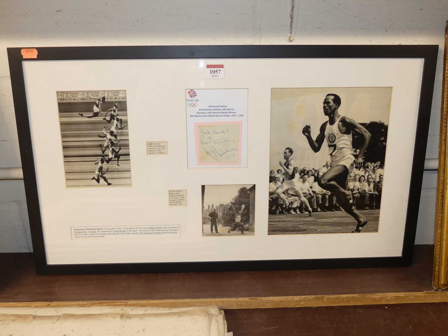 A framed display of cuttings commemorating British athlete McDonald Bailey's achievement in