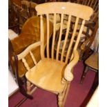A contemporary beech slat back farmhouse rocking armchair, width 66.5cm