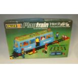 Two boxes of mainly train related by Faller, including one boxed set