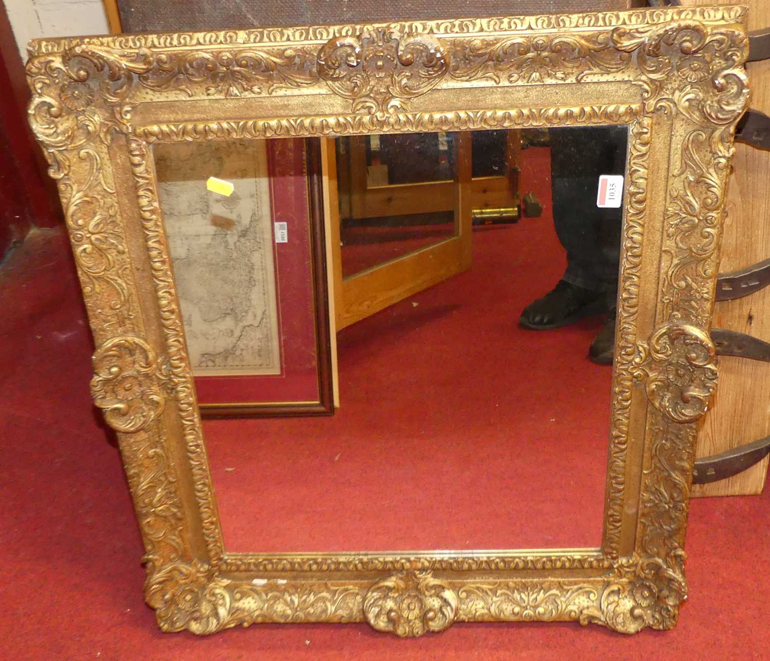 A 19th century gilt composition picture frame with later inset mirrorplate, full dimensions 67 x