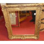 A 19th century gilt composition picture frame with later inset mirrorplate, full dimensions 67 x