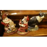 Three various reproduction painted cast iron door stops