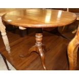 An early 19th century circular oak tilt-top pedestal table, dia. 72.5cm