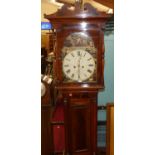 An early Victorian mahogany and flame mahogany long case clock, the painted arch dial signed