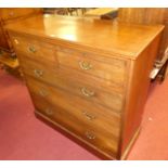 A circa 1900 walnut square front chest of two short over three long graduated drawers, having turned
