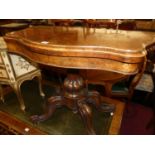 A mid-Victorian figured walnut serpentine front fold-over baize lined card table, raised on