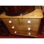 A Victorian pine low chest of two short over two long drawers, width 83cm