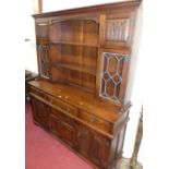 A contemporary Old Charm linenfold moulded oak dresser, w.153cm