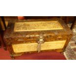 A contemporary Eastern heavy floral relief carved camphor wood hinge topped chest, w.70cm