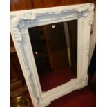 A contemporary white painted and heavily floral decorated bevelled rectangular wall mirror, 121 x