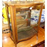 An Edwardian mahogany and chequer strung shaped single door low display cabinet with inset glass