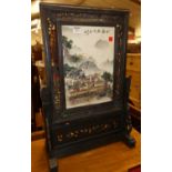 A contemporary Chinese landscape decorated porcelain plaque set within floral carved and pierced