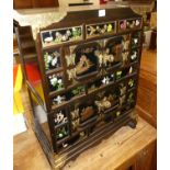 A contemporary Eastern stained elm, painted, gilt decorated and brass applied low side cabinet,