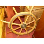 A stained elm and brass bound ships wheel, dia.92cm