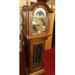 A contemporary Fenclocks of Suffolk, oak longcase clock having an arched moon phase brass dial,