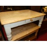 A rustic pine and part white painted round cornered low single drawer coffee table, on squat