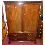 A 19th century mahogany linenpress, the twin upper doors (lacking linen slides), over base with