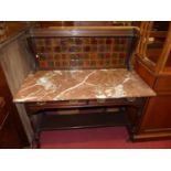 A late Victorian walnut variegated marble topped and tiled inset two-drawer wash stand, raised on