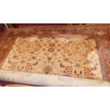 A Persian style European manufactured machine-made cream ground carpet