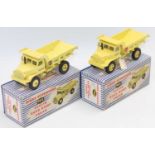 A boxed pair of Dinky No. 965 Euclid Rear Dump Truck, one with early logo, without glazing unit, and