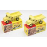A pair of boxed 965 Euclid Rear Dump Trucks, one with windows fitted and the other without (