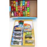 A group of boxed and unboxed Matchbox and Hotwheels models, conditions vary from good to near mint
